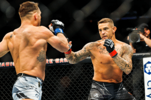 Dustin Poirier (red gloves) and Michael Chandler (blue gloves)