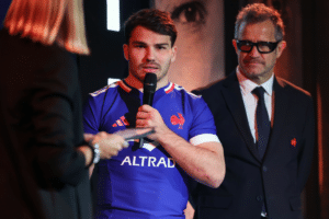 Antoine Dupont of France, alongside head coach Fabien Galthie