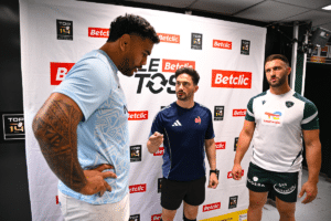 Youri DELHOMMEL of Pau and Romain Taofifenua of Racing with Referee Jeremy Rozier