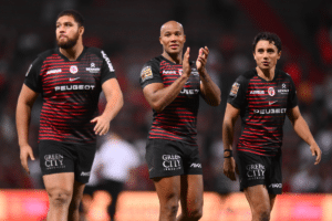 Teddy Thomas of Stade Toulousain and Ange Capuozzo of Stade Toulousain and Emmanuel Meafou of Stade Toulousain